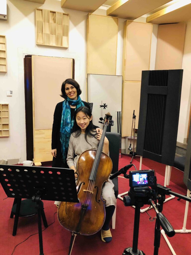 Elika and Brenda - the cellist - in the studio recording for Eiika's songs
